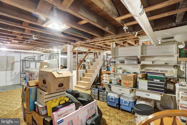 unfinished below grade area featuring stairway