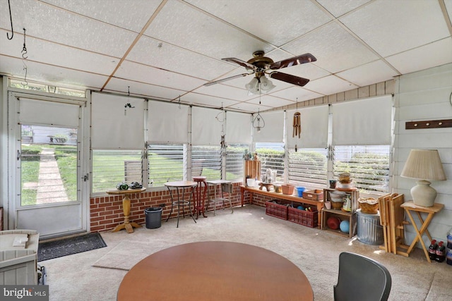 sunroom with ceiling fan and healthy amount of natural light