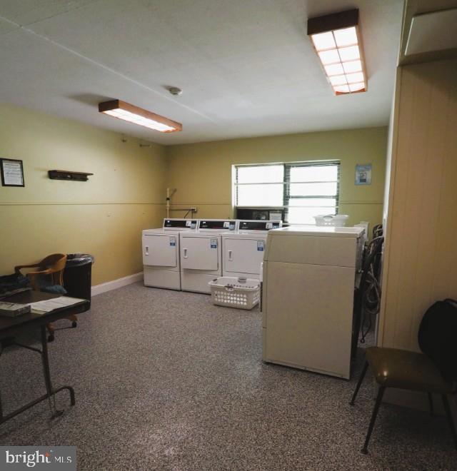 shared laundry room with washer and clothes dryer