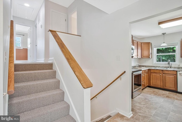 11545 Tomahawk Trl W, Lusby, MD 20657 - stairs featuring attic access and baseboards