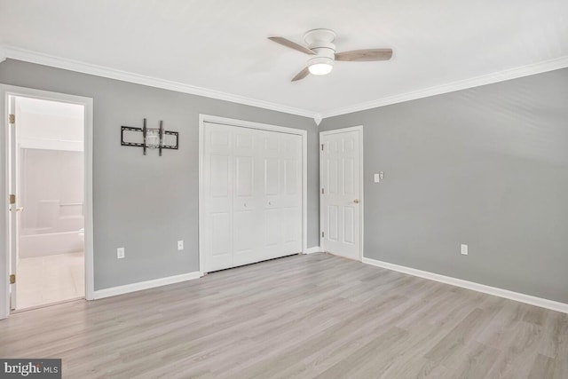 11545 Tomahawk Trl W, Lusby, MD 20657 - unfurnished bedroom featuring ornamental molding, wood finished floors, a closet, ensuite bathroom, and a ceiling fan