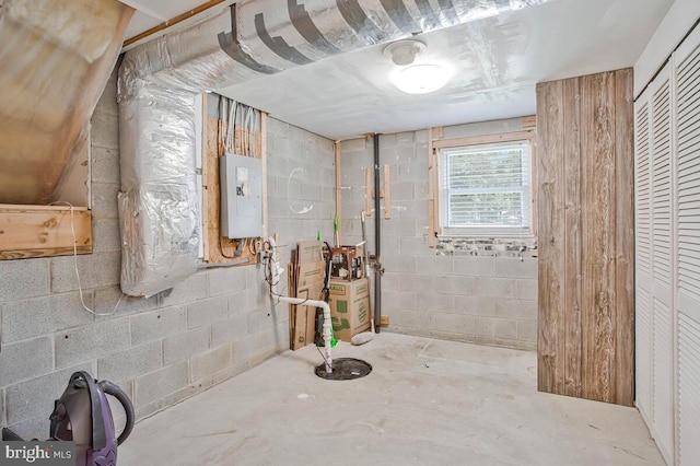 11545 Tomahawk Trl W, Lusby, MD 20657 - bathroom with electric panel, concrete block wall, and concrete flooring
