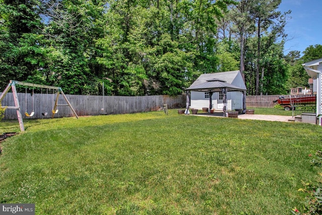 11545 Tomahawk Trl W, Lusby, MD 20657 - fenced backyard with a gazebo, a playground, and a patio