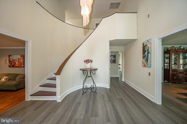 517 Righters Mill Rd, Penn Valley, PA 19072 - stairway featuring a high ceiling, wood finished floors, baseboards, and a chandelier