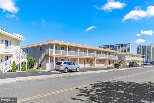 128 Captains Quarters Rd Unit 201, Ocean City, MD 21842 - view of building exterior with stairway