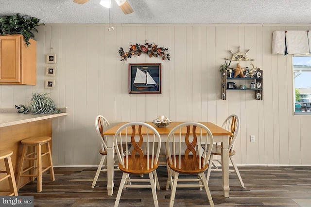 128 Captains Quarters Rd Unit 201, Ocean City, MD 21842 - dining space with dark wood-style floors, a textured ceiling, and a ceiling fan