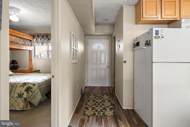 128 Captains Quarters Rd Unit 201, Ocean City, MD 21842 - corridor with dark wood-style floors, a textured ceiling, and baseboards