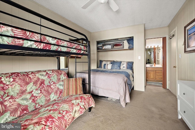 128 Captains Quarters Rd Unit 201, Ocean City, MD 21842 - bedroom featuring carpet flooring, a textured ceiling, and a ceiling fan