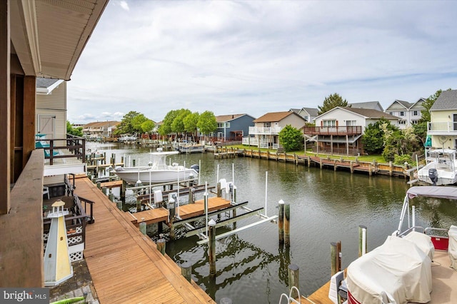128 Captains Quarters Rd Unit 201, Ocean City, MD 21842 - dock area featuring boat lift, a water view, and a residential view