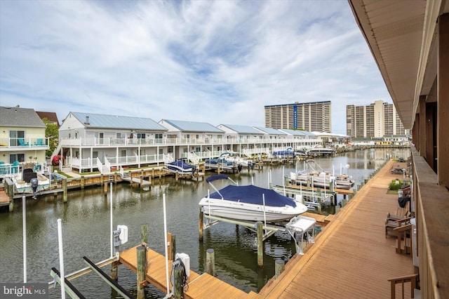 128 Captains Quarters Rd Unit 201, Ocean City, MD 21842 - dock featuring boat lift and a water view
