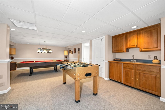 recreation room featuring a sink, a paneled ceiling, light colored carpet, billiards table, and baseboards