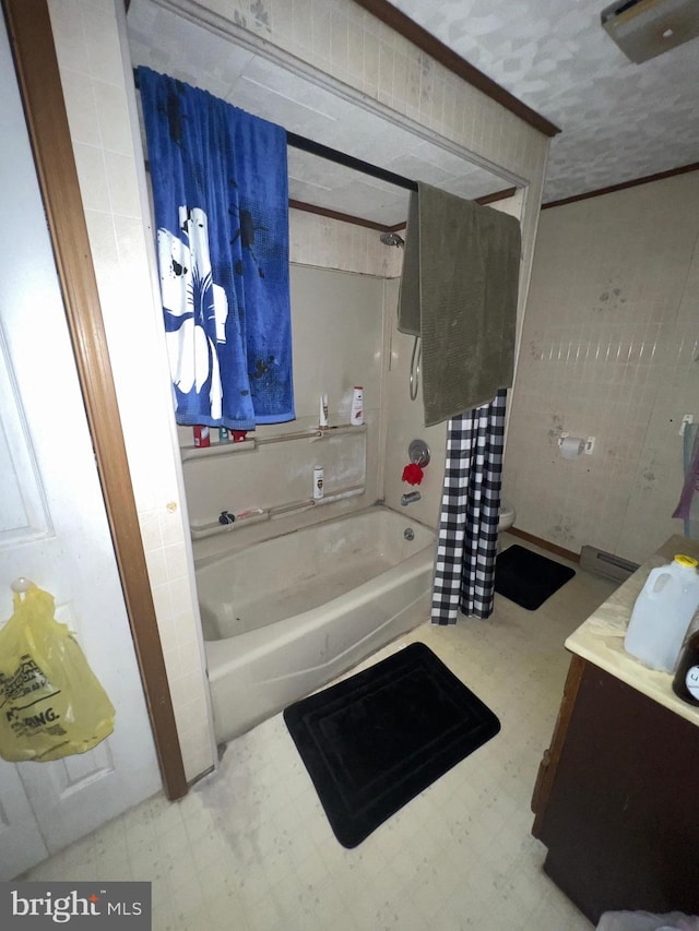 411 S Vine St, Shamokin, PA 17872 - bathroom featuring tile patterned floors, vanity, and shower / bath combo