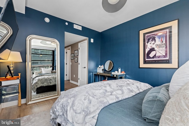 1300 4th St SE Unit 404, Washington, DC 20003 - bedroom with wood finished floors and baseboards