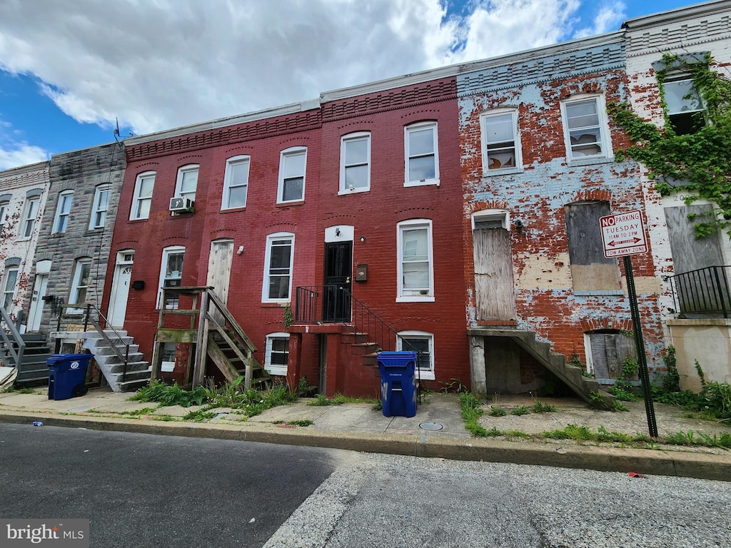 multi unit property featuring brick siding and stairway