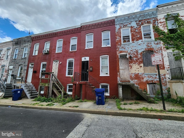 multi unit property featuring brick siding and stairway