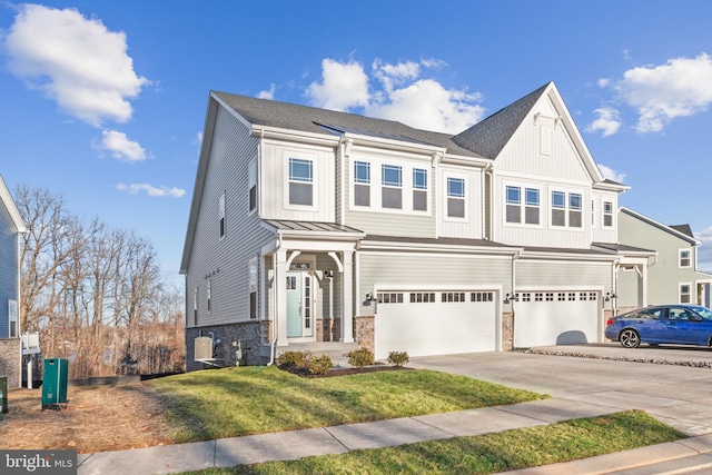 508 Waters Landing Dr, Essex, MD 21221 - view of front of house with an attached garage, concrete driveway, a front lawn, stone siding, and board and batten siding
