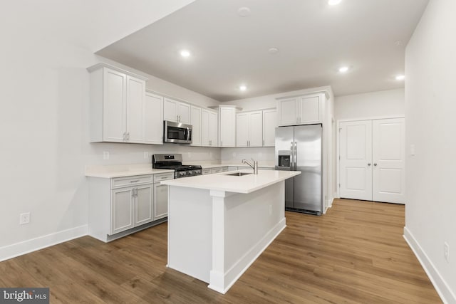 508 Waters Landing Dr, Essex, MD 21221 - kitchen featuring appliances with stainless steel finishes, baseboards, a sink, light countertops, and recessed lighting