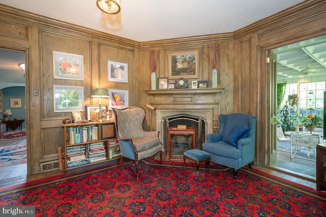 sitting room with a fireplace and arched walkways
