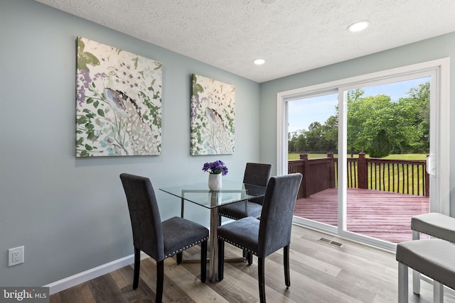1207 Blithe Ct, Upper Marlboro, MD 20774 - dining space featuring wood finished floors, a textured ceiling, baseboards, and recessed lighting