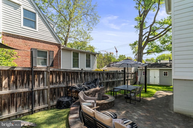 3503 Norris Pl, Alexandria, VA 22305 - view of patio featuring fence, an outdoor structure, outdoor dining space, a storage unit, and outdoor lounge area