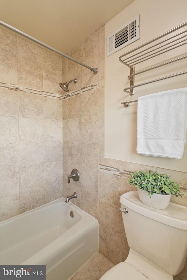 full bath featuring toilet and  shower combination