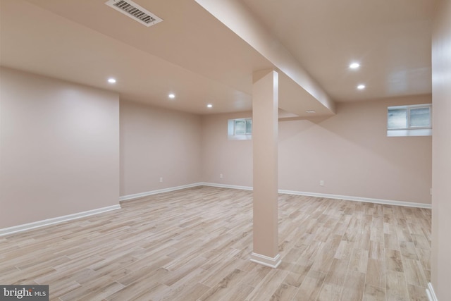 basement featuring light wood-type flooring, recessed lighting, and baseboards