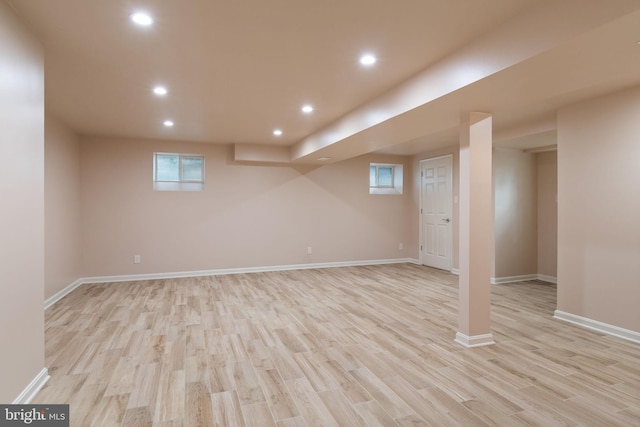 basement with light wood finished floors, recessed lighting, and baseboards
