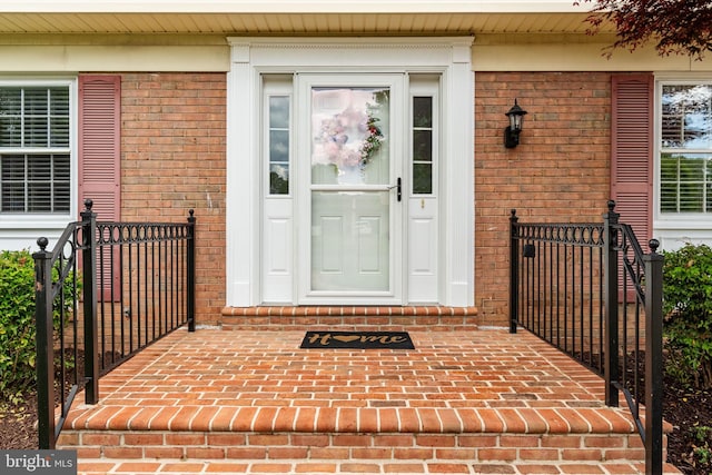property entrance with brick siding