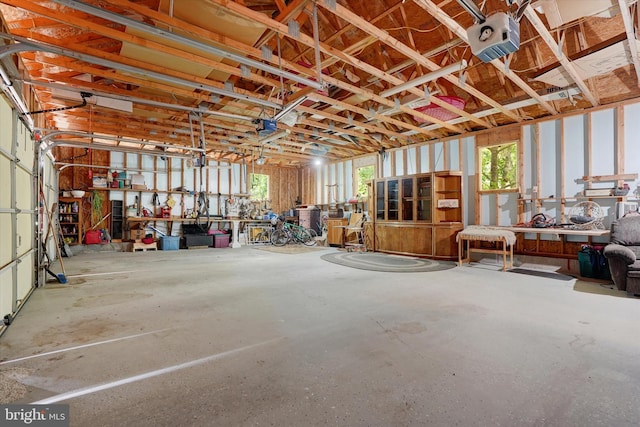 13450 Millstone Cir, Hancock, MD 21750 - garage featuring a garage door opener and a workshop area