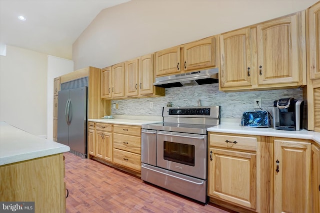 13450 Millstone Cir, Hancock, MD 21750 - kitchen with appliances with stainless steel finishes, light brown cabinetry, under cabinet range hood, backsplash, and lofted ceiling