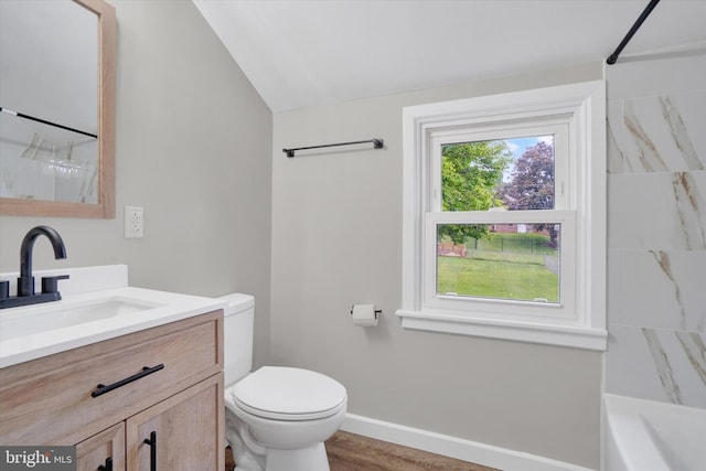 full bathroom featuring a shower, toilet, vanity, vaulted ceiling, and baseboards