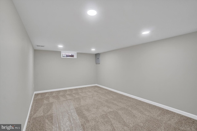 finished basement featuring recessed lighting, carpet flooring, and baseboards
