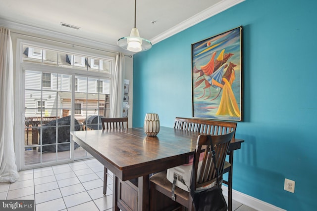 806 Ryan St, Baltimore, MD 21230 - dining space featuring crown molding and light tile patterned floors