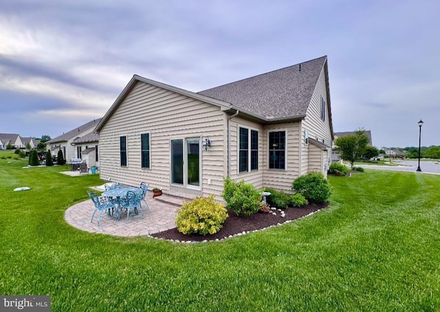 843 Summer Breeze Path, Cochranville, PA 19330 - back of house featuring a lawn, a patio, and roof with shingles