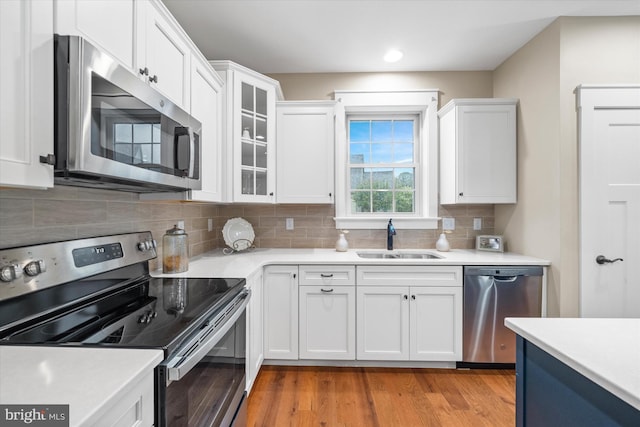 843 Summer Breeze Path, Cochranville, PA 19330 - kitchen with stainless steel appliances, a sink, white cabinetry, light countertops, and recessed lighting