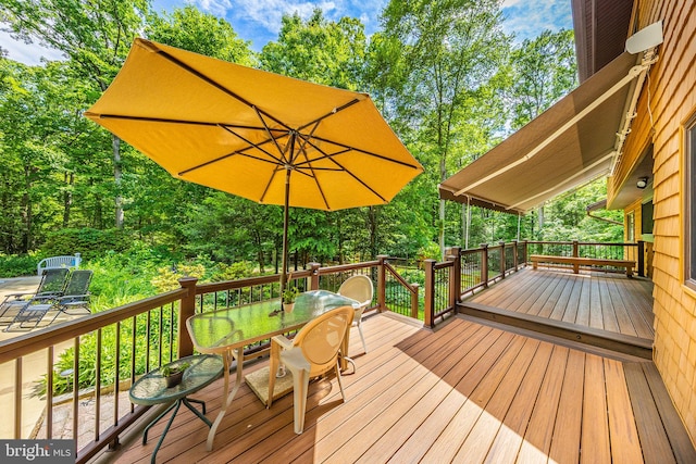 8323 Morningside Dr, Manassas, VA 20112 - wooden terrace featuring outdoor dining space and view of wooded area