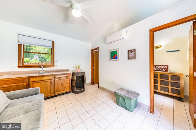 8323 Morningside Dr, Manassas, VA 20112 - kitchen with a wall unit AC, lofted ceiling, a sink, a ceiling fan, and light tile patterned floors