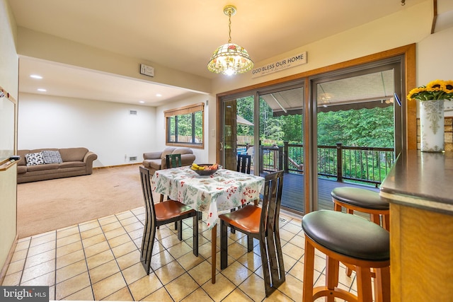 8323 Morningside Dr, Manassas, VA 20112 - dining space featuring light carpet, light tile patterned floors, recessed lighting, and baseboards