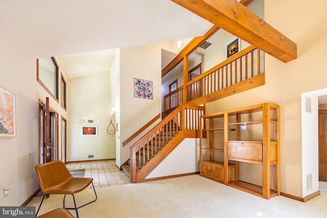 8323 Morningside Dr, Manassas, VA 20112 - staircase with a towering ceiling, baseboards, carpet, and french doors