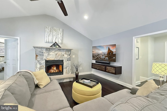 10 Greystone Dr, Lewes, DE 19958 - living room with dark wood finished floors, lofted ceiling, a fireplace, ceiling fan, and baseboards