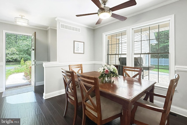 10 Greystone Dr, Lewes, DE 19958 - dining area featuring dark wood finished floors, crown molding, ceiling fan, wainscoting, and baseboards