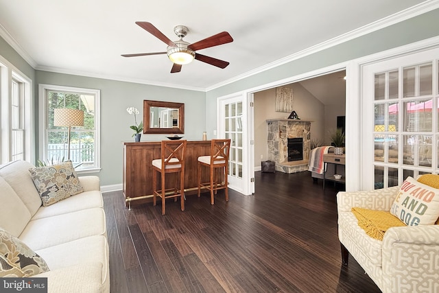 10 Greystone Dr, Lewes, DE 19958 - living room featuring wood-type flooring, ceiling fan, baseboards, ornamental molding, and a fireplace