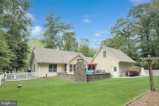 10 Greystone Dr, Lewes, DE 19958 - rear view of house featuring a shingled roof, outdoor lounge area, a patio area, and central air condition unit