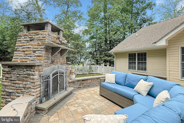 10 Greystone Dr, Lewes, DE 19958 - view of patio / terrace with an outdoor living space with a fireplace and fence