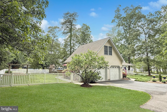 10 Greystone Dr, Lewes, DE 19958 - view of property exterior featuring driveway, a garage, and roof with shingles