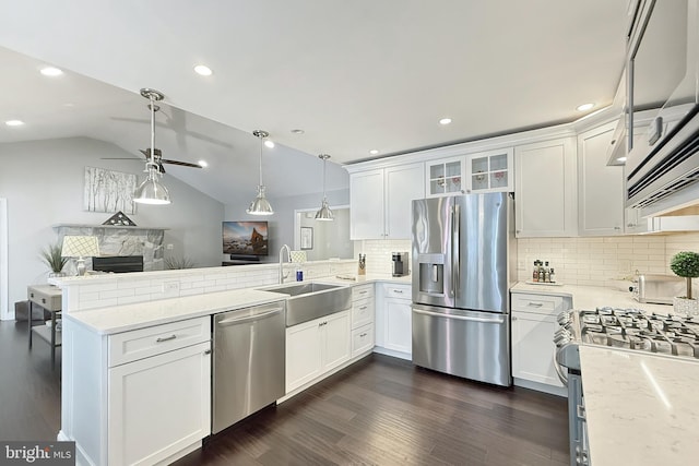 10 Greystone Dr, Lewes, DE 19958 - kitchen featuring appliances with stainless steel finishes, a sink, a peninsula, ceiling fan, and dark wood-style flooring