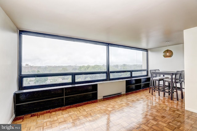 4000 N Charles St Unit 905, Baltimore, MD 21218 - living area featuring radiator, baseboards, and floor to ceiling windows