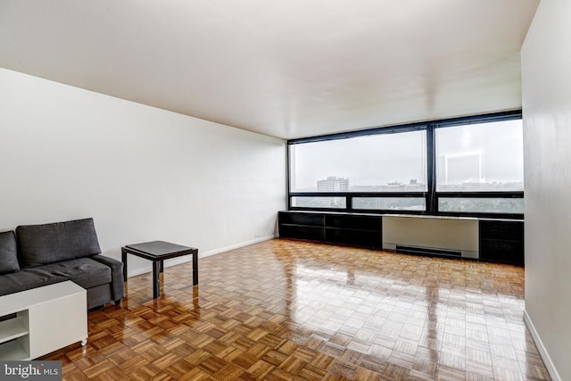 4000 N Charles St Unit 905, Baltimore, MD 21218 - unfurnished living room with baseboards