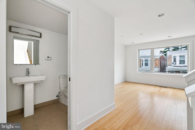 315 Dupont St, Philadelphia, PA 19128 - half bathroom featuring toilet and wood finished floors