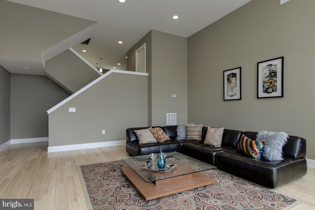 315 Dupont St, Philadelphia, PA 19128 - living room with light wood finished floors, recessed lighting, and stairway